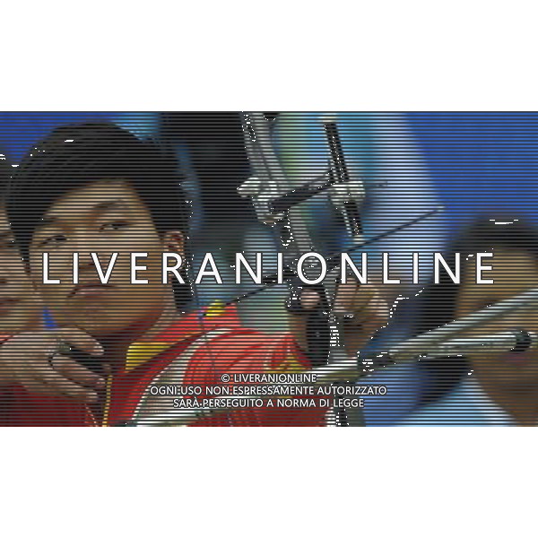 (101122) -- GUANGZHOU, Nov. 22, 2010 () -- China\'s archer Dai Xiaoxiang competes during men\'s team 1/4 eliminations match of archery at the 16th Asian Games in Guangzhou, south China\'s Guangdong Province, Nov. 22, 2010. China beat Malaysia 224-220. (/Gesang Dawa) ©photoshot/Agenzia Aldo Liverani Sas - ITALY ONLY - CINA: 16mi Giochi Asiatici