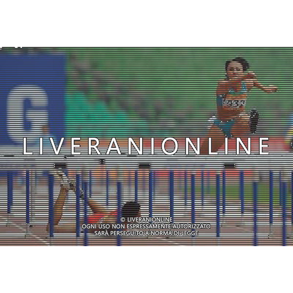 (101122) -- GUANGZHOU, Nov. 22, 2010 () -- Uzbekistan\'s Yuliya Tarasova (R) competes while Thailand\'s Amornrat Winatho tumbles down during the women\'s 100m hurdles of heptathlon of athletics at the 16th Asian Games in Guangzhou, south China\'s Guangdong Province, Nov. 22, 2010. (/Guo Dayue) ©photoshot/Agenzia Aldo Liverani Sas - ITALY ONLY - CINA: 16mi Giochi Asiatici