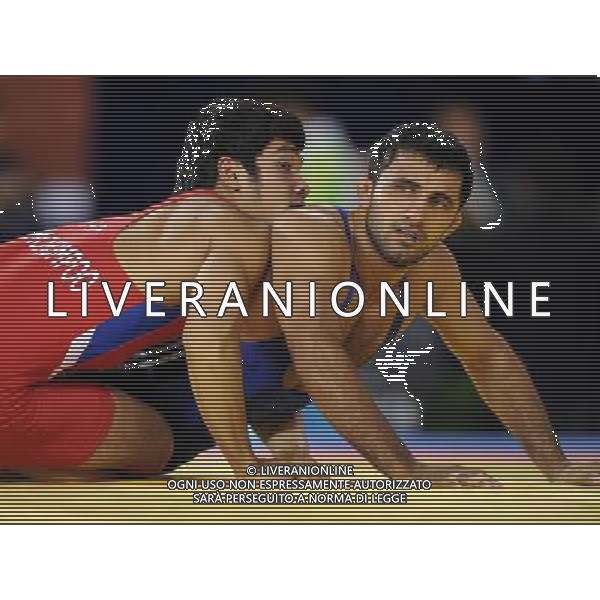 (101121) -- GUANGZHOU, Nov. 21, 2010 () -- Sunikumar Rana(R) of India fights against Sutep Oomchompoo of Thailand during the bronze medal match of Men¡¯s Greco-Roman 66kg Final of Wrestling at the 16th Asian Games in Guangzhou, south China\'s Guangdong Province, Nov. 21, 2010. Sunikumar Rana won the match and took the bronze. (/Yan Yan)(wll) ©photoshot/Agenzia Aldo Liverani Sas - ITALY ONLY - CINA: 16mi Giochi Asiatici
