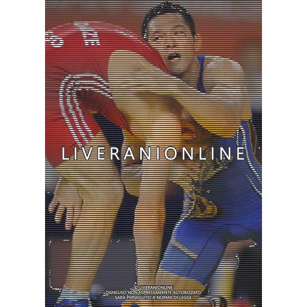 (101121) -- GUANGZHOU, Nov. 21, 2010 () -- Tsutomu Fujimura(R) of Japan fights against Besiki Saldadze of Uzbekistan during the bronze medal match of Men¡¯s Greco-Roman 66kg Final of Wrestling at the 16th Asian Games in Guangzhou, south China\'s Guangdong Province, Nov. 21, 2010. Tsutomu Fujimura won the match and took the bronze. (/Yan Yan)(wll) ©photoshot/Agenzia Aldo Liverani Sas - ITALY ONLY - CINA: 16mi Giochi Asiatici