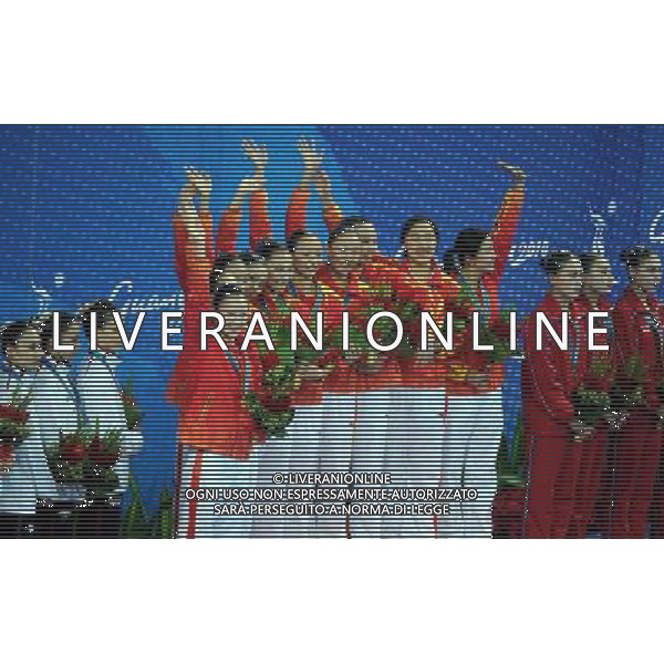 From left, silver winners of Japan, gold winners of China and bronze winner of North Korea celebrate after the Free Routine of Synchronised Swimming at the 16th Asian Games in Foshan in Guangdong province on Saturday, Nov. 20, 2010.(Photo By Kun Ge/ColorChinaPhoto) - AG. ALDO LIVERANI SAS ITALY ONLY CINA - 16mi GIOCHI ASIATICI: specialita\' Nuoto sincronizzato
