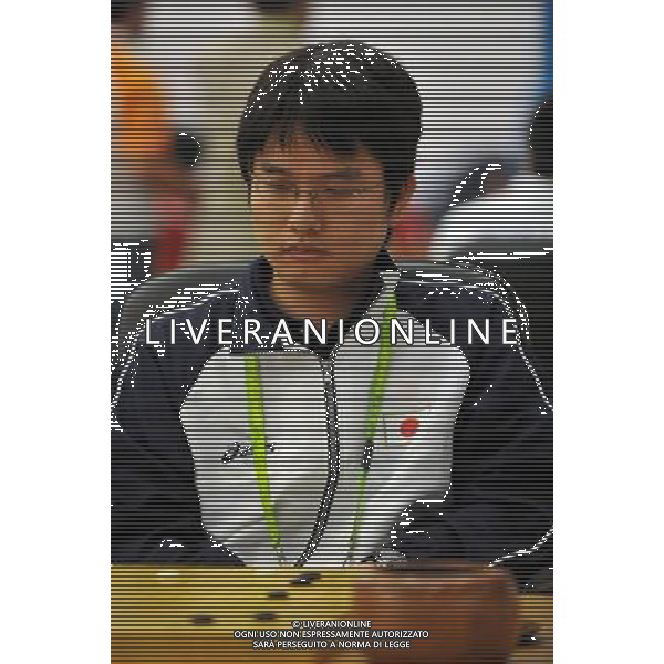 (101123) -- GUANGZHOU, Nov. 23, 2010 (Xinhua) -- Japan\'s Keigo Yamashita reacts during the men\'s team first session of Weiqi(the chess-like board game) against Thailand at the 16th Asian Games in Guangzhou, south China\'s Guangdong Province, Nov. 23, 2010. (Xinhua/Zhu Zheng) ©PHOTOSHOT/Agenzia Aldo Liverani Sas - ITALY ONLY: CINA - 16mi GIOCHI OLIMPICI ASIATICI