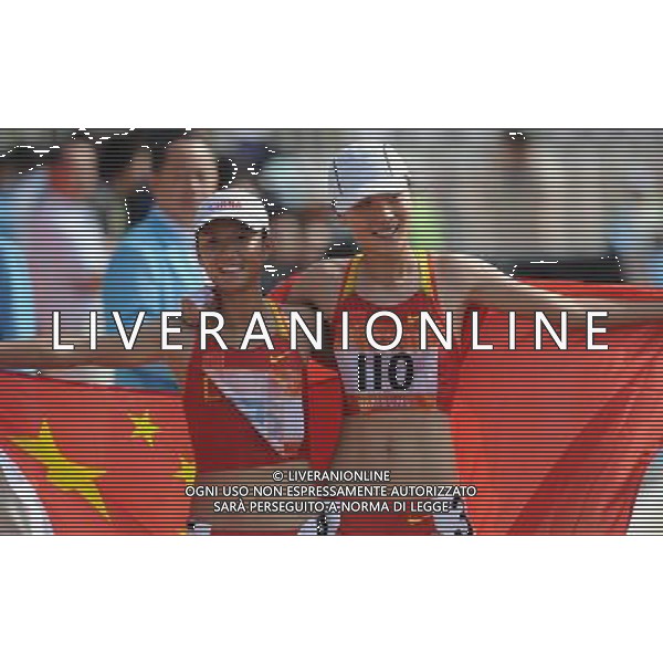 (101123) -- GUANGZHOU, Nov. 23, 2010 (Xinhua) -- China\'s Liu Hong (L) jubilates with her compatriot Li Yanfei during the women\'s 20km race walking at the 16th Asian Games in Guangzhou, south China\'s Guangdong Province, Nov. 23, 2010. Liu won the title with 1 hour 30 minutes and 6 seconds. Li Saifei got the bronze medal. (Xinhua/Li Gang) ©PHOTOSHOT/Agenzia Aldo Liverani Sas - ITALY ONLY: CINA - 16mi GIOCHI OLIMPICI ASIATICI