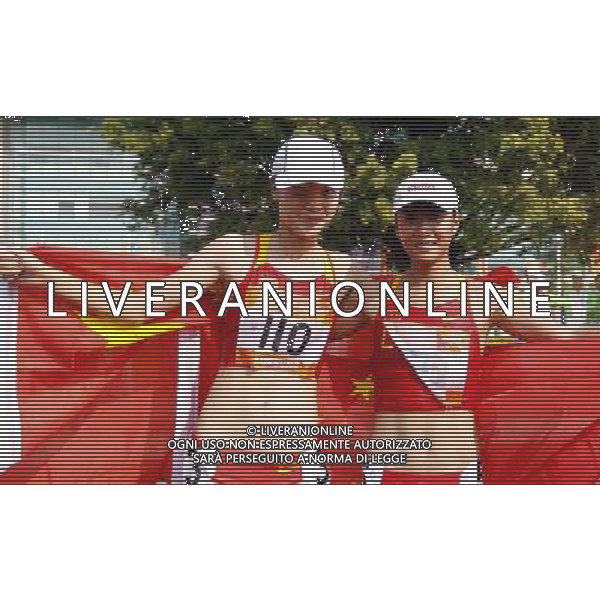 (101123) -- GUANGZHOU, Nov. 23, 2010 (Xinhua) -- China\'s Liu Hong (R) jubilates with her compatriot Li Yanfei after the women\'s 20km race walking at the 16th Asian Games in Guangzhou, south China\'s Guangdong Province, Nov. 23, 2010. Liu won the title with 1 hour 30 minutes and 6 seconds. Li Yanfei got the bronze medal. (Xinhua/Liao Yujie) ©PHOTOSHOT/Agenzia Aldo Liverani Sas - ITALY ONLY: CINA - 16mi GIOCHI OLIMPICI ASIATICI