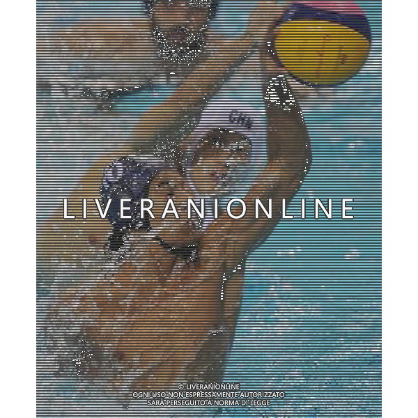 (101123) -- GUANGZHOU, Nov. 23, 2010 () -- Saudi Arabia\'s Bader Nasser M Al Dughather (front) shoots during the men\'s quarterfinal of waterpolo against China at the 16th Asian Games in Guangzhou, south China\'s Guangdong Province, Nov. 23, 2010. China won by 22-2. (/Lui Siu Wai) ©PHOTOSHOT/Agenzia Aldo Liverani Sas - ITALY ONLY: CINA - 16mi GIOCHI OLIMPICI ASIATICI