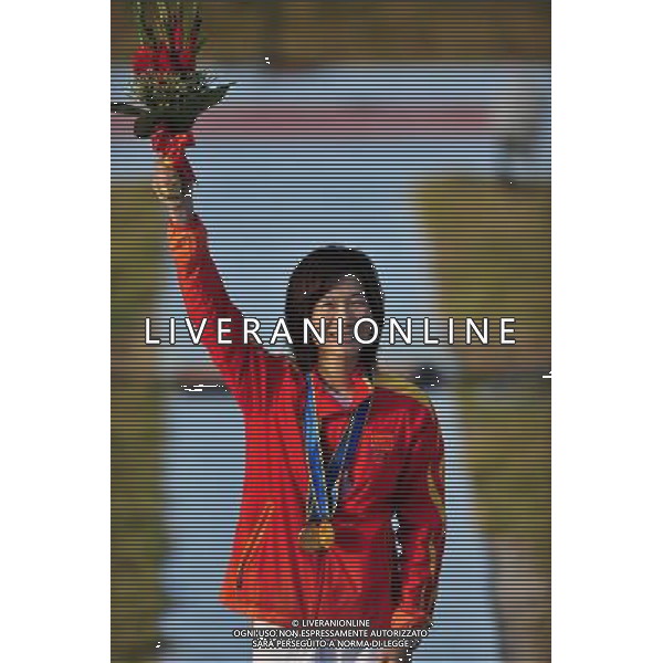 (101123) -- GUANGZHOU, Nov. 23, 2010 () -- Gold medalist Wei Ning of China celebrates on the podium during the awarding ceremony for the women\'s Skeet of shooting event at the 16th Asian Games in Guangzhou, south China\'s Guangdong Province, Nov. 23, 2010. (/Chen Yehua) ©PHOTOSHOT/Agenzia Aldo Liverani Sas - ITALY ONLY: CINA - 16mi GIOCHI OLIMPICI ASIATICI