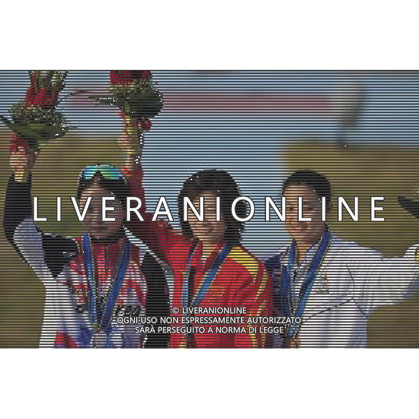 (101123) -- GUANGZHOU, Nov. 23, 2010 () -- Gold medalist Wei Ning (C) of China, silver medalist Kim Minji (L) of South Korea and bronze medalist Sutiya Jiewchaloemmit of Thailand celebrate on the podium during the awarding ceremony for the women\'s Skeet of shooting event at the 16th Asian Games in Guangzhou, south China\'s Guangdong Province, Nov. 23, 2010. (/Chen Yehua) ©PHOTOSHOT/Agenzia Aldo Liverani Sas - ITALY ONLY: CINA - 16mi GIOCHI OLIMPICI ASIATICI
