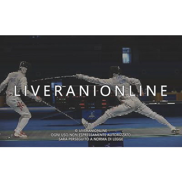 (101123) -- GUANGZHOU, Nov. 23, 2010 () -- Zhu Jun (R) of China competes during the men\'s team foil semifinal against Hong Kong of China at the 16th Asian Games in Guangzhou, south China\'s Guangdong Province, Nov. 23, 2010. China won the match by 45-21 and entered the final. (/Li Yong) ©PHOTOSHOT/Agenzia Aldo Liverani Sas - ITALY ONLY: CINA - 16mi GIOCHI OLIMPICI ASIATICI