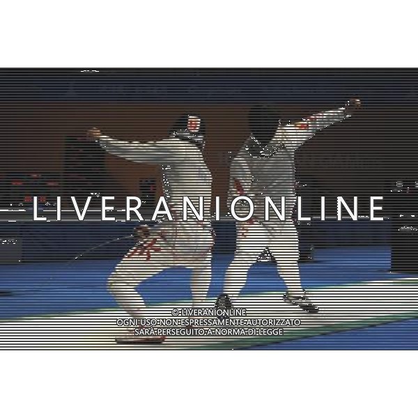 (101123) -- GUANGZHOU, Nov. 23, 2010 () -- Huang Liangcai (R) of China competes during the men\'s team foil semifinal against Hong Kong of China at the 16th Asian Games in Guangzhou, south China\'s Guangdong Province, Nov. 23, 2010. China won the match by 45-21 and entered the final. (/Li Yong) ©PHOTOSHOT/Agenzia Aldo Liverani Sas - ITALY ONLY: CINA - 16mi GIOCHI OLIMPICI ASIATICI