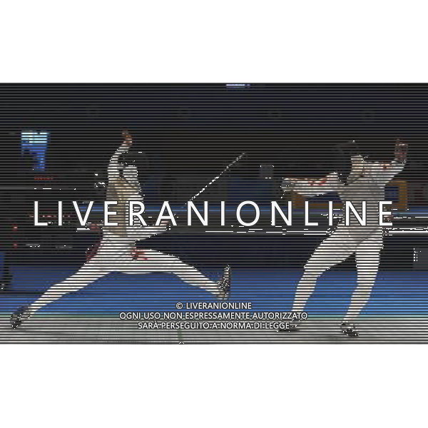 (101123) -- GUANGZHOU, Nov. 23, 2010 () -- Ngan Kyk (L) of Hong Kong of China competes during the men\'s team foil semifinal against China at the 16th Asian Games in Guangzhou, south China\'s Guangdong Province, Nov. 23, 2010. Hong Kong of China lost the match by 21-45 and got the bronze medal. (/Li Yong) ©PHOTOSHOT/Agenzia Aldo Liverani Sas - ITALY ONLY: CINA - 16mi GIOCHI OLIMPICI ASIATICI