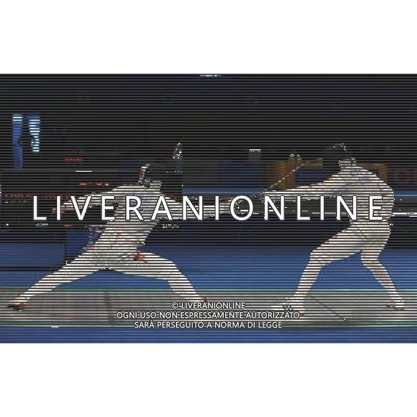 (101123) -- GUANGZHOU, Nov. 23, 2010 () -- Lau Kwok Kin (L) of Hong Kong of China competes during the men\'s team foil semifinal against China at the 16th Asian Games in Guangzhou, south China\'s Guangdong Province, Nov. 23, 2010. Hong Kong of China lost the match by 21-45 and got the bronze medal. (/Li Yong) ©PHOTOSHOT/Agenzia Aldo Liverani Sas - ITALY ONLY: CINA - 16mi GIOCHI OLIMPICI ASIATICI
