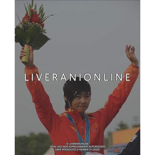 (101123) -- GUANGZHOU, Nov. 23, 2010 () -- Silver medalist Chinese Cheng Ming waves to spectators during the awarding ceremony for the women\'s individual of archery at the 16th Asian Games in Guangzhou, south China\'s Guangdong Province, Nov. 23, 2010.(/Gesang Dawa)(sss) ©PHOTOSHOT/Agenzia Aldo Liverani Sas - ITALY ONLY: CINA - 16mi GIOCHI OLIMPICI ASIATICI