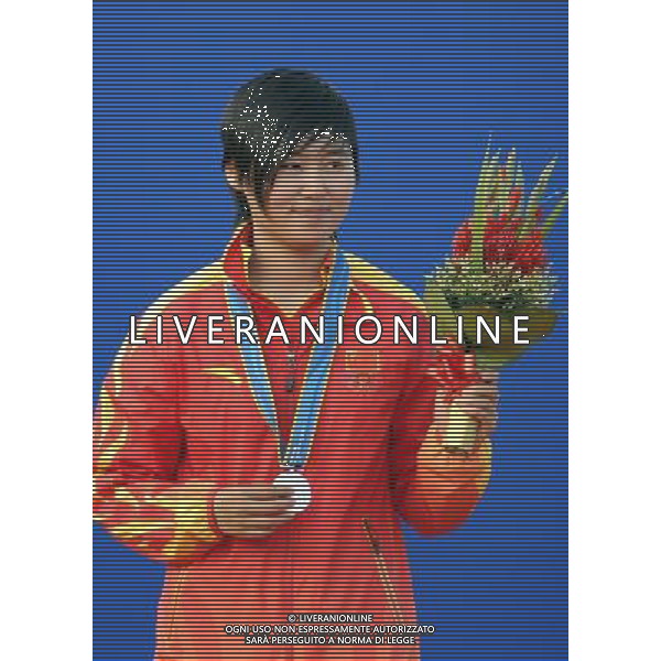 (101123) -- GUANGZHOU, Nov. 23, 2010 () -- Silver medalist Chinese Cheng Ming poses during the awarding ceremony for the women\'s individual of archery at the 16th Asian Games in Guangzhou, south China\'s Guangdong Province, Nov. 23, 2010.(/Gesang Dawa)(sss) ©PHOTOSHOT/Agenzia Aldo Liverani Sas - ITALY ONLY: CINA - 16mi GIOCHI OLIMPICI ASIATICI