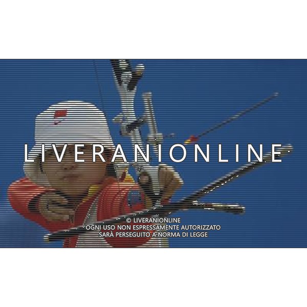 (101123) -- GUANGZHOU, Nov. 23, 2010 () -- Chinese archer Cheng Ming competes during the women\'s individual event final of archery at the 16th Asian Games in Guangzhou, south China\'s Guangdong Province, Nov. 23, 2010. Cheng Ming lost to Yun Ok Hee of South Korea by 0-6 and got the silver medal. (/Gesang Dawa)(sss) ©PHOTOSHOT/Agenzia Aldo Liverani Sas - ITALY ONLY: CINA - 16mi GIOCHI OLIMPICI ASIATICI