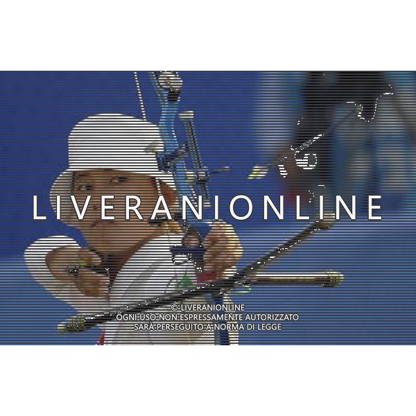 (101123) -- GUANGZHOU, Nov. 23, 2010 () -- Kwon Un Sil of Democratic People\'s Republic of Korea(DPRK) competes during the women\'s individual bronze medal match of archery at the 16th Asian Games in Guangzhou, south China\'s Guangdong Province, Nov. 23, 2010. Kwon Un Sil beat Indian archer Deepika Kumari by 6-2 and won the bronze medal. (/Gesang Dawa)(sss) ©PHOTOSHOT/Agenzia Aldo Liverani Sas - ITALY ONLY: CINA - 16mi GIOCHI OLIMPICI ASIATICI