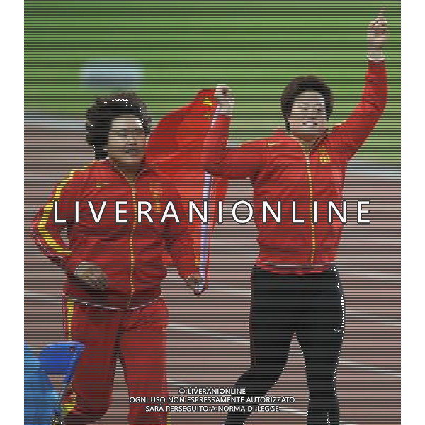 (101123) -- GUANGZHOU, Nov. 23, 2010 () -- China\'s Li Yanfeng (R) and Song Aimin celebrate after the women\'s discus throw final of athletics at the 16th Asian Games in Guangzhou, south China\'s Guangdong Province, Nov. 23, 2010. Li Yanfeng claimed the title with 66.18 meters. Song Aimin won the silver. (/Li Gang) ©PHOTOSHOT/Agenzia Aldo Liverani Sas - ITALY ONLY: CINA - 16mi GIOCHI OLIMPICI ASIATICI