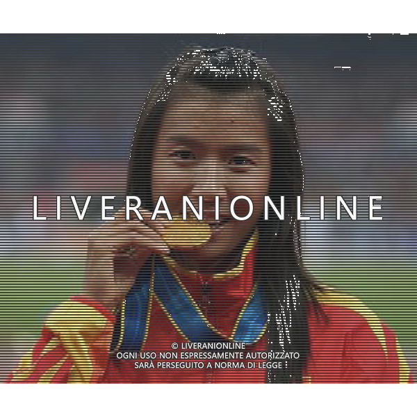(101123) -- GUANGZHOU, Nov. 23, 2010 () -- Gold medalist China\'s Liu Hong reacts during the awarding ceremony for the women\'s 20km race walking at the 16th Asian Games in Guangzhou, south China\'s Guangdong Province, Nov. 23, 2010. (/Liao Yujie) ©PHOTOSHOT/Agenzia Aldo Liverani Sas - ITALY ONLY: CINA - 16mi GIOCHI OLIMPICI ASIATICI