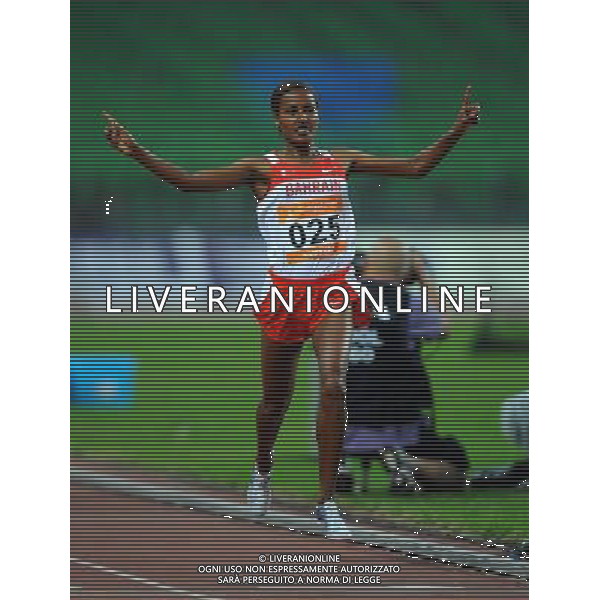 (101123) -- GUANGZHOU, Nov. 23, 2010 () -- Maryam Yusuf Isa Jamal of Bahrain jubilates after running across the finish line during the women\'s 1500m final of athletics at the 16th Asian Games in Guangzhou, south China\'s Guangdong Province, Nov. 23, 2010. Maryam Yusuf Isa Jamal claimed the title of the event. (/Guo Dayue) ©PHOTOSHOT/Agenzia Aldo Liverani Sas - ITALY ONLY: CINA - 16mi GIOCHI OLIMPICI ASIATICI