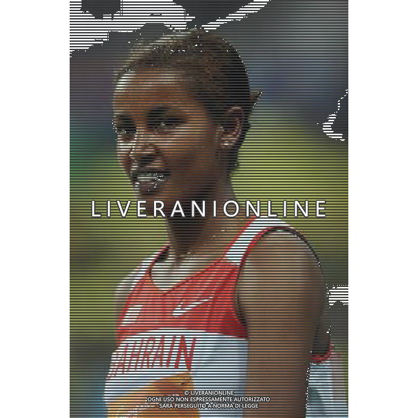 (101123) -- GUANGZHOU, Nov. 23, 2010 () -- Maryam Yusuf Isa Jamal of Bahrain smiles after the women\'s 1500m final of athletics at the 16th Asian Games in Guangzhou, south China\'s Guangdong Province, Nov. 23, 2010. Maryam Yusuf Isa Jamal claimed the title of the event with 4 minutes and 8.22 seconds. (/Guo Dayue) ©PHOTOSHOT/Agenzia Aldo Liverani Sas - ITALY ONLY: CINA - 16mi GIOCHI OLIMPICI ASIATICI