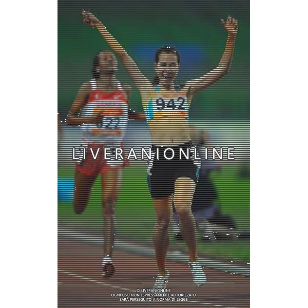 (101123) -- GUANGZHOU, Nov. 23, 2010 () -- Thanh Hang Truong of Viet Nam (Front) jubilates after the women\'s 1500m final of athletics at the 16th Asian Games in Guangzhou, south China\'s Guangdong Province, Nov. 23, 2010. Thanh Hang Truong won the silver medal of the event with 4 minutes and 9.58 seconds. (/Guo Dayue) ©PHOTOSHOT/Agenzia Aldo Liverani Sas - ITALY ONLY: CINA - 16mi GIOCHI OLIMPICI ASIATICI