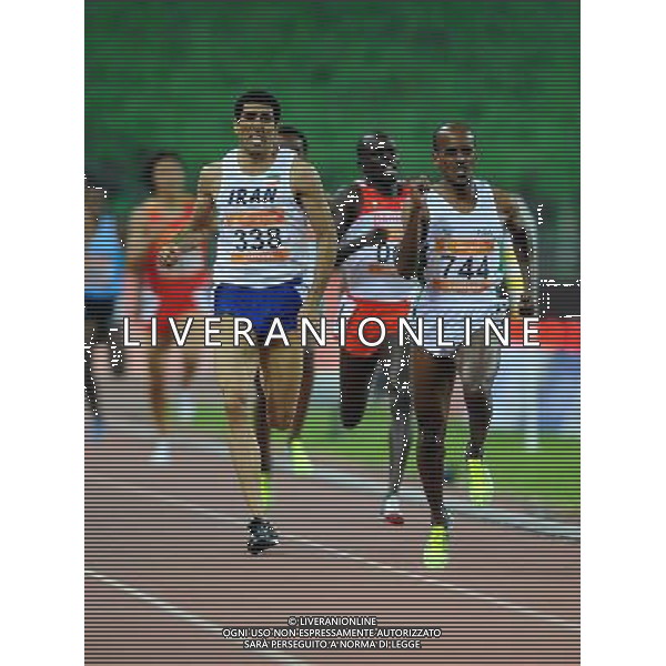 (101123) -- GUANGZHOU, Nov. 23, 2010 () -- Saudi Arabia\'s Mohammed Othman Shaween (Front R) and Iran\'s Sajad Moradi (Front L) compete during the men\'s 1500m final of athletics at the 16th Asian Games in Guangzhou, south China\'s Guangdong Province, Nov. 23, 2010. Mohammed Othman Shaween claimed the title with 3 minutes and 36.49 seconds. Sajad Moradi got the silver medal. (/Guo Dayue) ©PHOTOSHOT/Agenzia Aldo Liverani Sas - ITALY ONLY: CINA - 16mi GIOCHI OLIMPICI ASIATICI