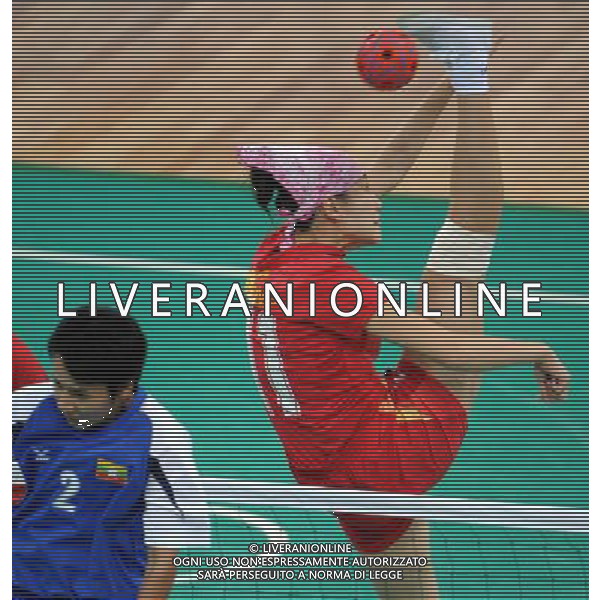 (101124) -- GUANGZHOU, Nov. 24, 2010 (Xinhua) -- China\'s Song Cheng (R) competes during the sepaktakraw women\'s regu round robin round 10 against Myanmar at the 16th Asian Games in Guangzhou, south China\'s Guangdong Province, Nov. 24, 2010. China won the match by 2-1. (Xinhua/Guo Yong) ©PHOTOSHOT/Agenzia Aldo Liverani Sas - ITALY ONLY: CINA - 16mi GIOCHI OLIMPICI ASIATICI