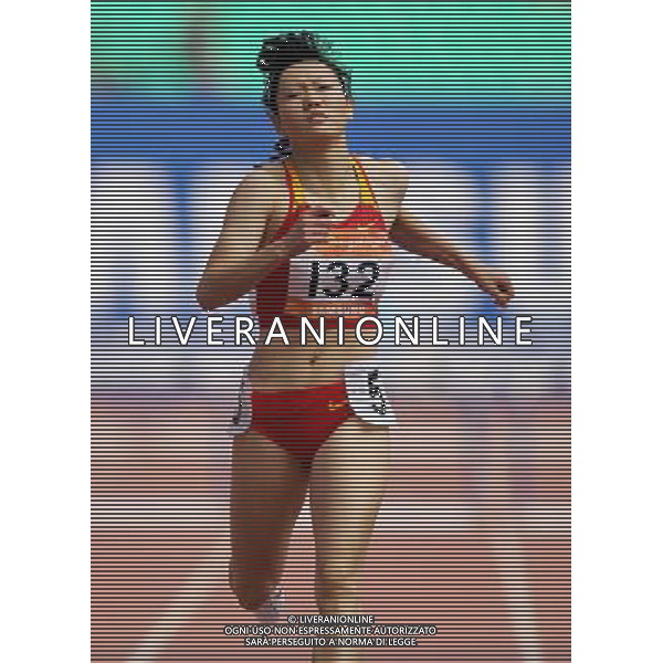 (101124) -- GUANGZHOU, Nov. 24, 2010 (Xinhua) -- China\'s Wang Xing runs across the finish line during the women\'s 400m hurdles round 1 of athletics at the 16th Asian Games in Guangzhou, south China\'s Guangdong Province, Nov. 24, 2010. Wang entered the final of the event. (Xinhua/Li Ming) ©PHOTOSHOT/Agenzia Aldo Liverani Sas - ITALY ONLY: CINA - 16mi GIOCHI OLIMPICI ASIATICI