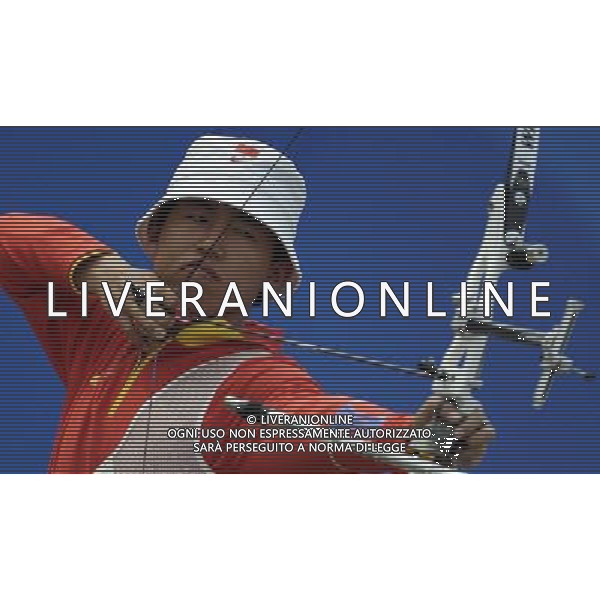 (101124) -- GUANGZHOU, Nov. 24, 2010 (Xinhua) -- China\'s Xing Yu competes during men\'s individual 1/8 eliminations of Archery at the 16th Asian Games in Guangzhou, south China\'s Guangdong Province, Nov. 24, 2010. Xing Yu advanced into the quarter-final after defeating his opponent, Kazakhstan\'s Oibek Saidiyev. (Xinhua/Gesang Dawa) ©PHOTOSHOT/Agenzia Aldo Liverani Sas - ITALY ONLY: CINA - 16mi GIOCHI OLIMPICI ASIATICI
