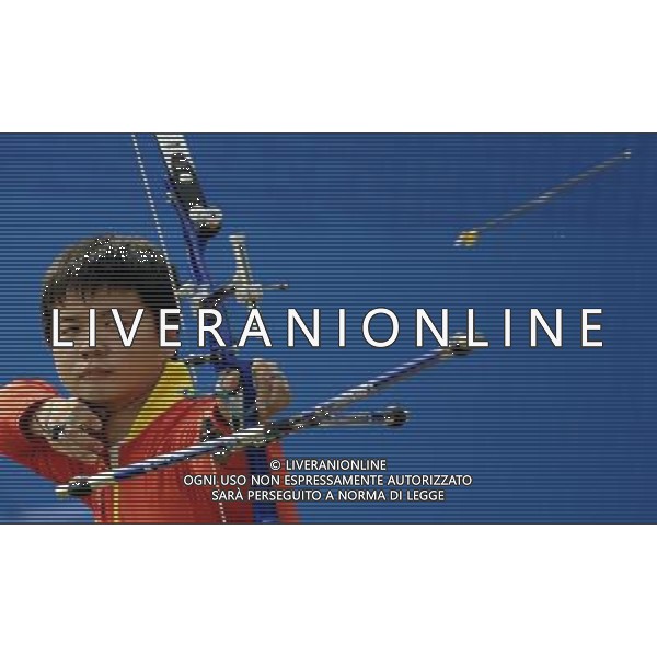 (101124) -- GUANGZHOU, Nov. 24, 2010 (Xinhua) -- China\'s Chen Wenyuan competes during men\'s individual 1/8 eliminations of Archery at the 16th Asian Games in Guangzhou, south China\'s Guangdong Province, Nov. 24, 2010. Chen Wenyuan advanced into the quarter-final after defeating his opponent, Mongolia\'s Gan-Erdene Gombodorj. (Xinhua/Gesang Dawa) ©PHOTOSHOT/Agenzia Aldo Liverani Sas - ITALY ONLY: CINA - 16mi GIOCHI OLIMPICI ASIATICI