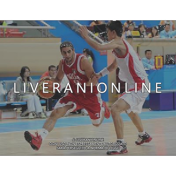(101126) -- GUANGZHOU, Nov. 26, 2010 () -- Ali El Zubi (L) of Jordan breaks through during the men\'s basketball match against DPRK at the 16th Asian Games in Guangzhou, south China\'s Guangdong Province, Nov. 26, 2010. Jordan won the match 79-74 and ranked the 7th. (/Li Gang) - Xinhua - Photoshot - Ag. Aldo Liverani sas ITALY ONLY CINA - 16mi GIOCHI ASIATICI : PALLACANESTRO ( BASKET)