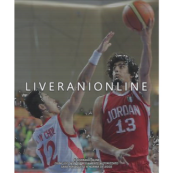 (101126) -- GUANGZHOU, Nov. 26, 2010 () -- Ali Zaghab (R) of Jordan vies with Kim Un Chol of DPRK during the men\'s basketball match at the 16th Asian Games in Guangzhou, south China\'s Guangdong Province, Nov. 26, 2010. Jordan won the match 79-74 and ranked the 7th. (/Li Gang) - Xinhua - Photoshot - Ag. Aldo Liverani sas ITALY ONLY CINA - 16mi GIOCHI ASIATICI : PALLACANESTRO ( BASKET)