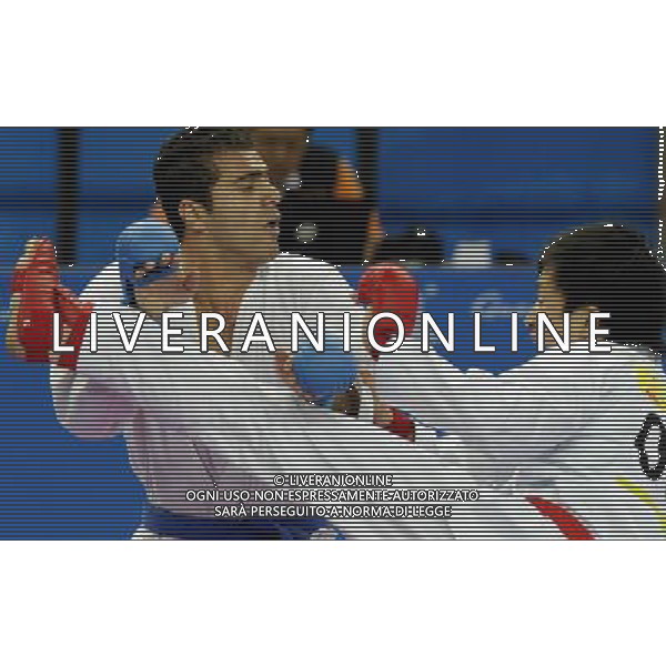 (101126) -- GUANGZHOU, Nov. 26, 2010 () -- Iran\'s Jasem Vishkaei Modami (L) competes during the men\'s -84kg final of Karate against Japan\'s Araga Ryutaro at the 16th Asian Games in Guangzhou, south China\'s Guangdong Province, Nov. 26, 2010. Jasem Vishkaei Modami won 6-2 and claimed the title of the event. (/Gesang Dawa) - Xinhua/Photoshot - Ag. Aldo Liverani sas ITALY ONLY CINA - 16mi GIOCHI OLIMPICI ASIATICI: KARATE