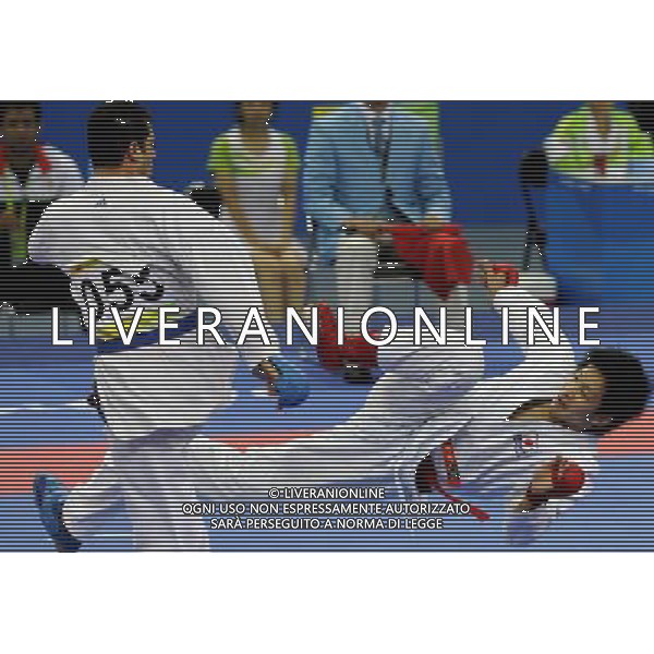 (101126) -- GUANGZHOU, Nov. 26, 2010 () -- Japan\'s Araga Ryutaro (R) competes during the men\'s -84kg final of Karate against Iran\'s Jasem Vishkaei Modami at the 16th Asian Games in Guangzhou, south China\'s Guangdong Province, Nov. 26, 2010. Araga Ryutaro lost 2-6 and got the silver medal. (/Gesang Dawa) - Xinhua/Photoshot - Ag. Aldo Liverani sas ITALY ONLY CINA - 16mi GIOCHI OLIMPICI ASIATICI: KARATE