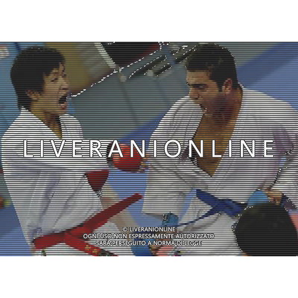 (101126) -- GUANGZHOU, Nov. 26, 2010 () -- Iran\'s Jasem Vishkaei Modami (R) competes during the men\'s -84kg final of Karate against Japan\'s Araga Ryutaro at the 16th Asian Games in Guangzhou, south China\'s Guangdong Province, Nov. 26, 2010. Jasem Vishkaei Modami won 6-2 and claimed the title of the event. (/Gesang Dawa) - Xinhua/Photoshot - Ag. Aldo Liverani sas ITALY ONLY CINA - 16mi GIOCHI OLIMPICI ASIATICI: KARATE
