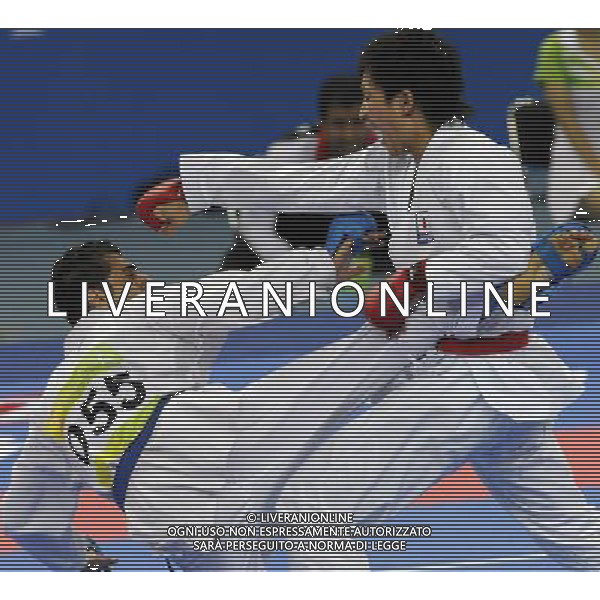 (101126) -- GUANGZHOU, Nov. 26, 2010 () -- Japan\'s Araga Ryutaro (R) competes during the men\'s -84kg final of Karate against Iran\'s Jasem Vishkaei Modami at the 16th Asian Games in Guangzhou, south China\'s Guangdong Province, Nov. 26, 2010. Araga Ryutaro lost 2-6 and got the silver medal. (/Gesang Dawa) - Xinhua/Photoshot - Ag. Aldo Liverani sas ITALY ONLY CINA - 16mi GIOCHI OLIMPICI ASIATICI: KARATE