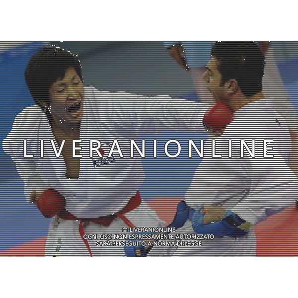 (101126) -- GUANGZHOU, Nov. 26, 2010 () -- Japan\'s Araga Ryutaro (L) competes during the men\'s -84kg final of Karate against Iran\'s Jasem Vishkaei Modami at the 16th Asian Games in Guangzhou, south China\'s Guangdong Province, Nov. 26, 2010. Araga Ryutaro lost 2-6 and got the silver medal. (/Gesang Dawa) - Xinhua/Photoshot - Ag. Aldo Liverani sas ITALY ONLY CINA - 16mi GIOCHI OLIMPICI ASIATICI: KARATE