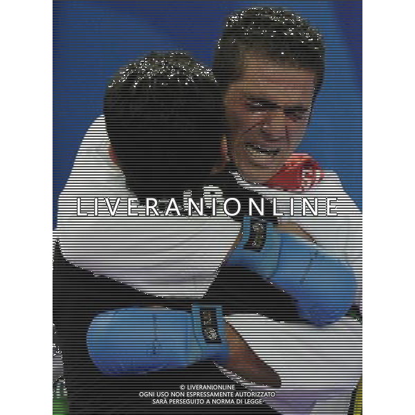 (101126) -- GUANGZHOU, Nov. 26, 2010 () -- Iran\'s Jasem Vishkaei Modami hugs with his coach after winning the men\'s -84kg final of Karate against Japan\'s Araga Ryutaro at the 16th Asian Games in Guangzhou, south China\'s Guangdong Province, Nov. 26, 2010. Jasem Vishkaei Modami won 6-2 and claimed the title of the event. (/Gesang Dawa) - Xinhua/Photoshot - Ag. Aldo Liverani sas ITALY ONLY CINA - 16mi GIOCHI OLIMPICI ASIATICI: KARATE
