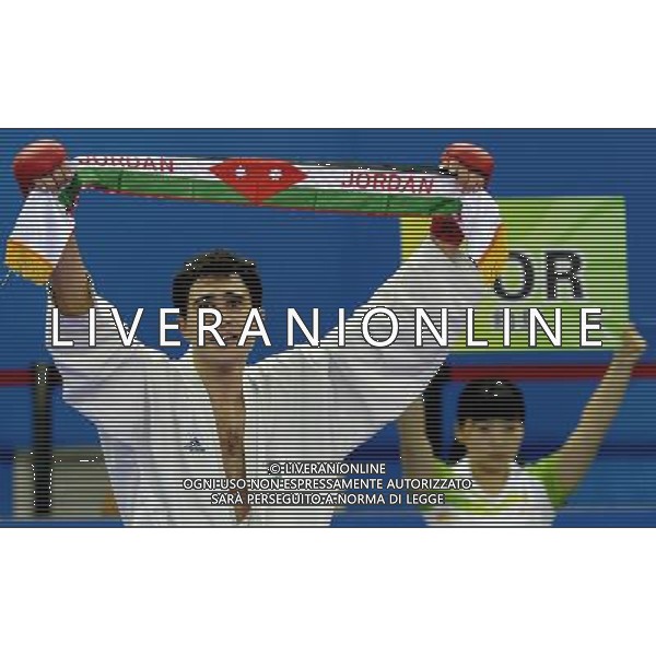 (101126) -- GUANGZHOU, Nov. 26, 2010 () -- Jordan\'s Mutasembellah Khair celebrates after winning the men\'s -84kg bronze medal match of Karate against South Korea\'s Jang Min Soo at the 16th Asian Games in Guangzhou, south China\'s Guangdong Province, Nov. 26, 2010. Mutasembellah Khair won 9-3 and got the bronze medal. (/Gesang Dawa) - Xinhua/Photoshot - Ag. Aldo Liverani sas ITALY ONLY CINA - 16mi GIOCHI OLIMPICI ASIATICI: KARATE