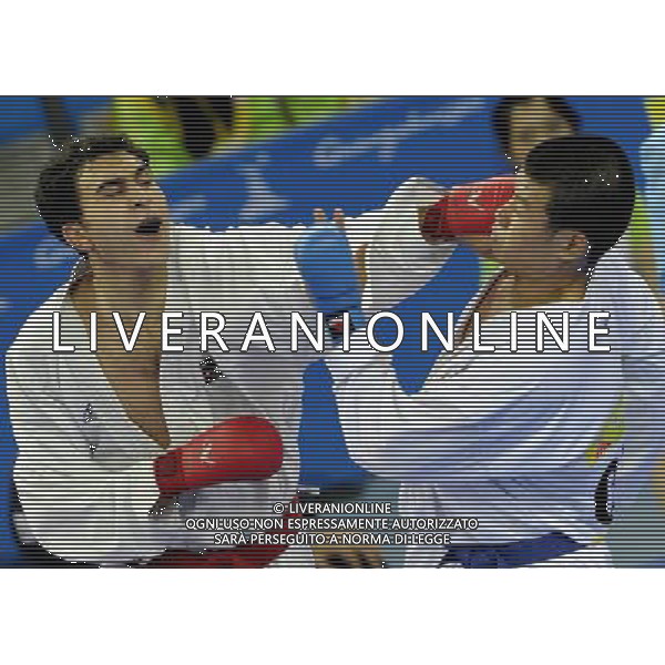 (101126) -- GUANGZHOU, Nov. 26, 2010 () -- Jordan\'s Mutasembellah Khair (L) competes during the men\'s -84kg bronze medal match of Karate against South Korea\'s Jang Min Soo at the 16th Asian Games in Guangzhou, south China\'s Guangdong Province, Nov. 26, 2010. Mutasembellah Khair won 9-3 and got the bronze medal. (/Gesang Dawa) - Xinhua/Photoshot - Ag. Aldo Liverani sas ITALY ONLY CINA - 16mi GIOCHI OLIMPICI ASIATICI: KARATE