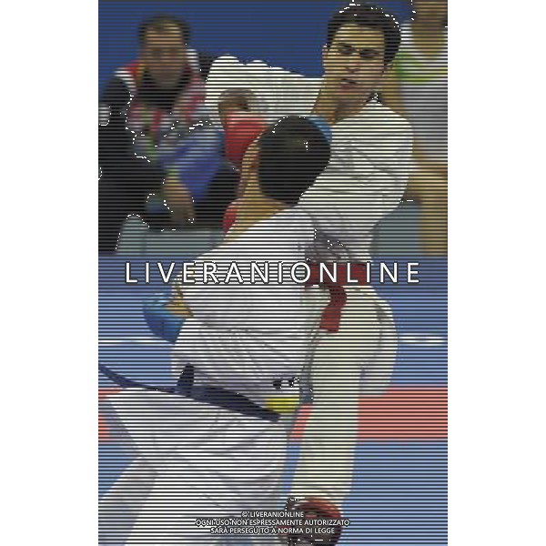 (101126) -- GUANGZHOU, Nov. 26, 2010 () -- Jordan\'s Mutasembellah Khair (back) competes during the men\'s -84kg bronze medal match of Karate against South Korea\'s Jang Min Soo at the 16th Asian Games in Guangzhou, south China\'s Guangdong Province, Nov. 26, 2010. Mutasembellah Khair won 9-3 and got the bronze medal. (/Gesang Dawa) - Xinhua/Photoshot - Ag. Aldo Liverani sas ITALY ONLY CINA - 16mi GIOCHI OLIMPICI ASIATICI: KARATE