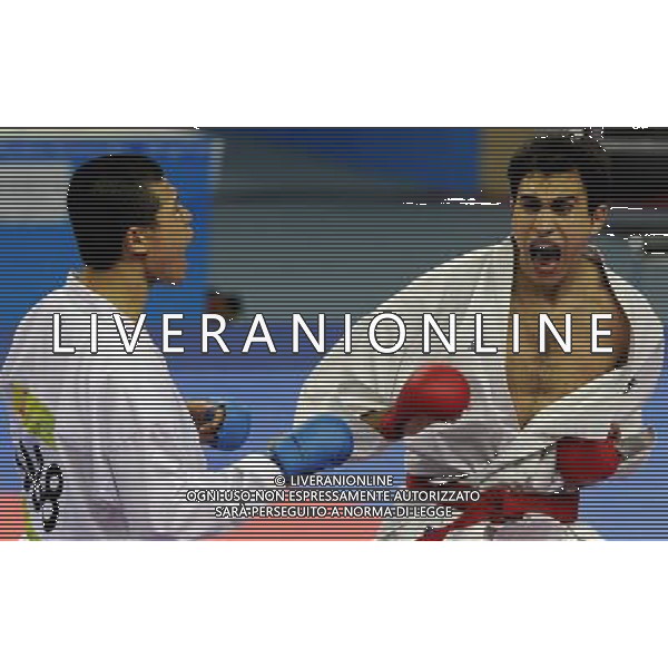(101126) -- GUANGZHOU, Nov. 26, 2010 () -- Jordan\'s Mutasembellah Khair (R) competes during the men\'s -84kg bronze medal match of Karate against South Korea\'s Jang Min Soo at the 16th Asian Games in Guangzhou, south China\'s Guangdong Province, Nov. 26, 2010. Mutasembellah Khair won 9-3 and got the bronze medal. (/Gesang Dawa) - Xinhua/Photoshot - Ag. Aldo Liverani sas ITALY ONLY CINA - 16mi GIOCHI OLIMPICI ASIATICI: KARATE