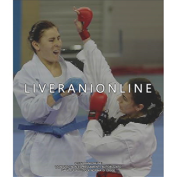 (101126) -- GUANGZHOU, Nov. 26, 2010 () -- Uzbekistan\'s Barno Mirzaeva (L) competes against Palestine\'s Zuhriia Mshenesh during the women\'s -61kg bronze medal match of Karate at the 16th Asian Games in Guangzhou, south China\'s Guangdong Province, Nov. 26, 2010. Barno Mirzaeva won 2-0 and got the bronze medal of the category. (/Gesang Dawa) - Xinhua/Photoshot - Ag. Aldo Liverani sas ITALY ONLY CINA - 16mi GIOCHI OLIMPICI ASIATICI: KARATE