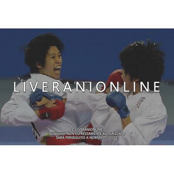 (101126) -- GUANGZHOU, Nov. 26, 2010 () -- Chan Ka Man (L) of Hong Kong, China competes against Chang Ting of Chinese Taipei during the women\'s -61kg bronze medal match of Karate at the 16th Asian Games in Guangzhou, south China\'s Guangdong Province, Nov. 26, 2010. Chan Ka Man won 3-0 and got the bronze medal of the category. (/Gesang Dawa) - Xinhua/Photoshot - Ag. Aldo Liverani sas ITALY ONLY CINA - 16mi GIOCHI OLIMPICI ASIATICI: KARATE