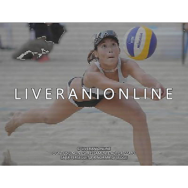 (101203) -- HONG KONG, Dec. 3, 2010 () -- Tse Wing Hung from Hong Kong of China competes against Japan\'s Mat Sunura/Watanabe Kei during the match at the Asian Women\'s Beach Volleyball Tournament in Hong Kong, south China, Dec. 3, 2010. The pair from Hong Kong of China Tse Wing Hung/Kong Cheuk Yee lost the match by 1-2. (/Lo Ping Fai) Photoshot-AG ALDO LIVERANI ONLY ITALY