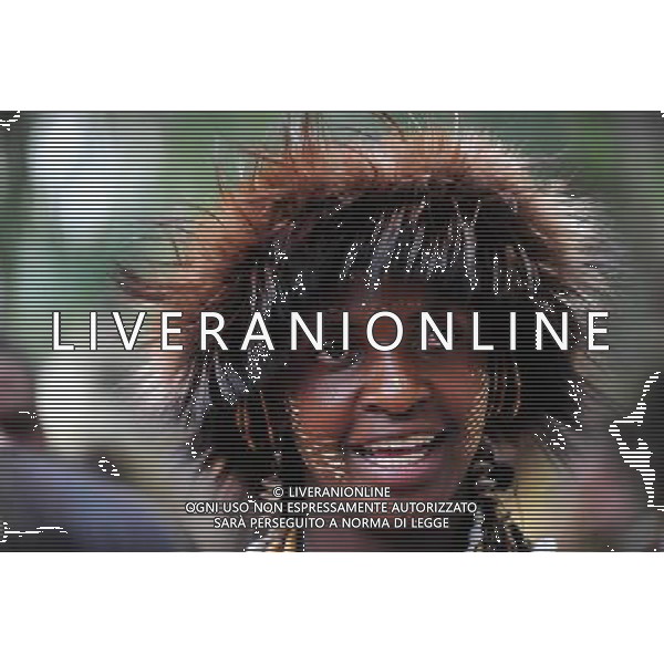 (101209) -- NAIROBI, Dec. 9, 2010 () -- A woman from an aboriginal tribe in Eastern Province of Kenya wears a headgear made of fur on Dec. 7, 2010. 42 aboriginal tribes in Kenya share the cultural diversity with their different kinds of headgears made of fur, feather and shells. (/Zhao Yingquan)(djj) - Xinhua/Photoshot - Ag. Aldo Liverani sas ITALY ONLY NAIROBI - VARI COPRICAPO DELLE TRIBU\' DEL KENYA