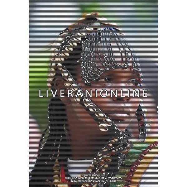 (101209) -- NAIROBI, Dec. 9, 2010 () -- A girl from an aboriginal tribe in Eastern Province of Kenya wears a headgear made of shells on Dec. 7, 2010. 42 aboriginal tribes in Kenya share the cultural diversity with their different kinds of headgears made of fur, feather and shells. (/Zhao Yingquan)(djj) - Xinhua/Photoshot - Ag. Aldo Liverani sas ITALY ONLY NAIROBI - VARI COPRICAPO DELLE TRIBU\' DEL KENYA