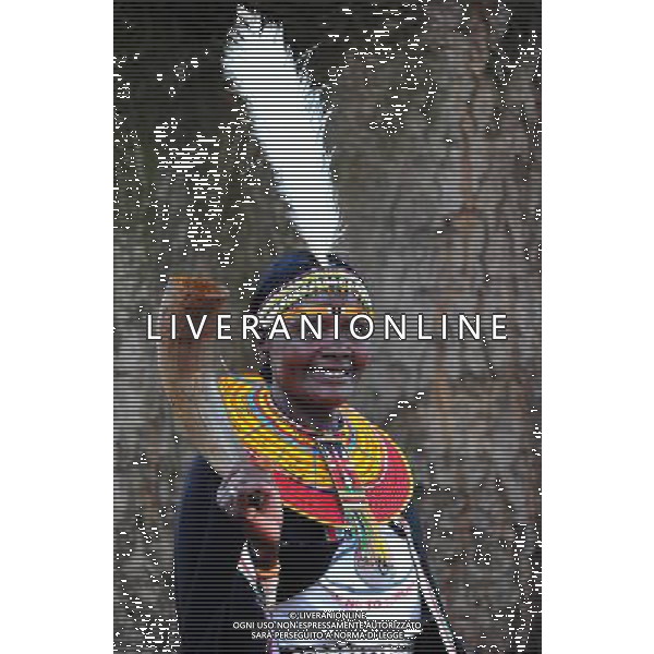 (101209) -- NAIROBI, Dec. 9, 2010 () -- A woman from an aboriginal tribe in Eastern Province of Kenya wears a headgear made of feather on Dec. 7, 2010. 42 aboriginal tribes in Kenya share the cultural diversity with their different kinds of headgears made of fur, feather and shells. (/Zhao Yingquan)(djj) - Xinhua/Photoshot - Ag. Aldo Liverani sas ITALY ONLY NAIROBI - VARI COPRICAPO DELLE TRIBU\' DEL KENYA