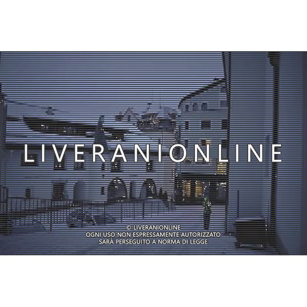 (101213) -- ST. MORITZ, Dec. 13, 2010 () -- A tourist walks in the downtown of St. Moritz, Switzerland, Dec. 11, 2010. St. Moritz, a resort town in Switzerland, is considered the oldest and one of the most famous winter resorts in the world due to its favorable location residents enjoy over 322 days of sunshine a year. It has been the host city for the 1928 and 1948 Winter Olympics and is one of three cities that have hosted the Winter Olympic Games twice. (/Yu Yang) (zyw) AG. ALDO LIVERANI SAS ITALY ONLY