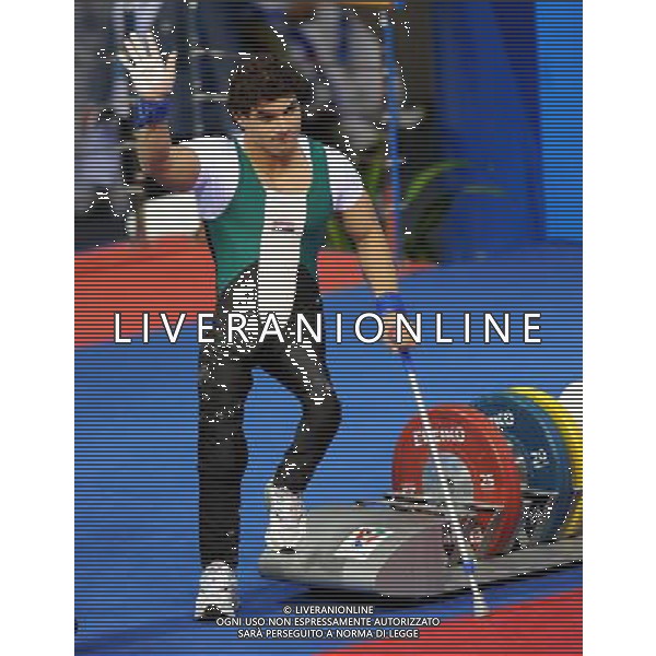 (101214) -- GUANGZHOU, Dec. 14, 2010 () -- Rasool Mohsin of Iraq waves to the audiences after winning the men\'s -56kg of Powerlifting at the Guangzhou 2010 Asian Para Games in Guangzhou, south China\'s Guangdong Province, Dec. 14, 2010. Rasool Mohsin of Irag won the gold medal of the event. (/Fan Changguo) (xm) AG. ALDO LIVERANI SAS ITALY ONLY