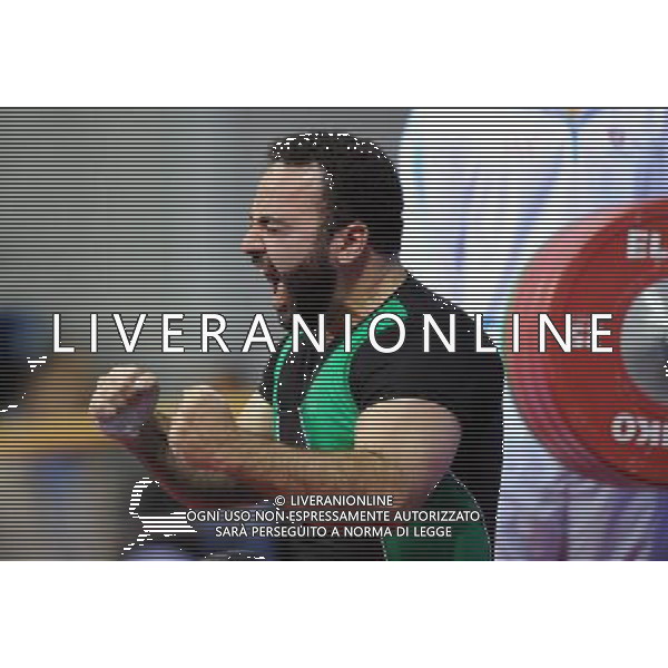 (101214) -- GUANGZHOU, Dec. 14, 2010 () -- Hamzeh Mohammadi of Iran reacts after winning the men\'s 60kg final of powerlifting competition at the Guangzhou 2010 Asian Para Games in Guangzhou, south China\'s Guangdong Province, Dec. 14, 2010. Hamzeh Mohammadi won the gold with 197.5 kg. (/Fan Changguo) AG. ALDO LIVERANI SAS ITALY ONLY